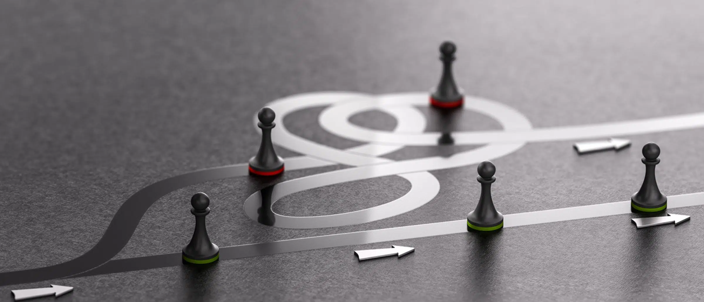 Black chess pieces on twisted path, arrows pointing to the right